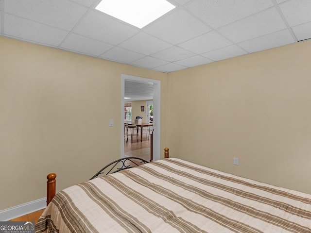 bedroom with hardwood / wood-style flooring