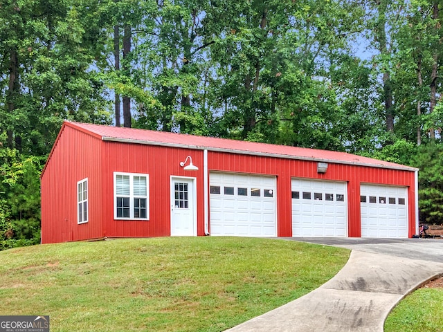 garage featuring a yard