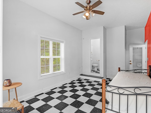 bedroom with ceiling fan and ensuite bathroom