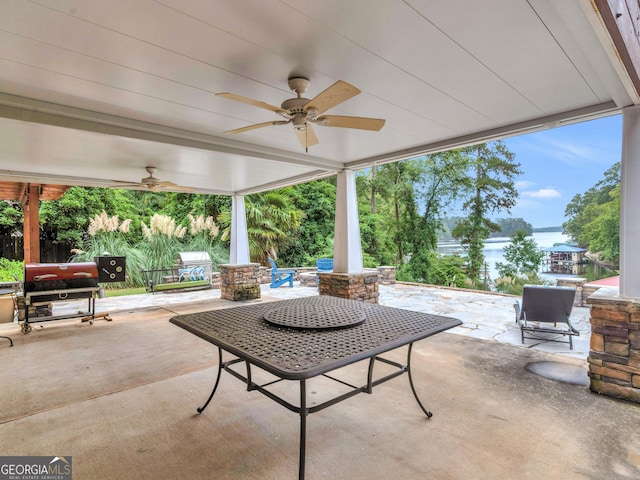 view of patio featuring a fire pit and ceiling fan