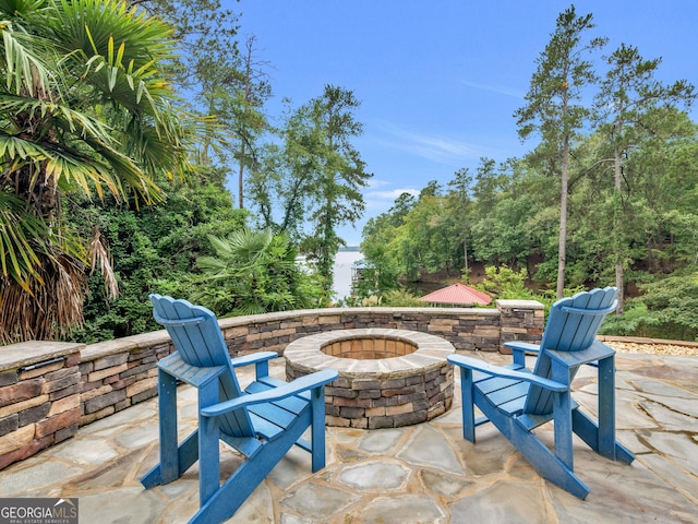 view of patio / terrace with an outdoor fire pit