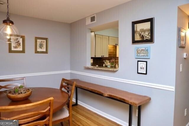 dining room with light hardwood / wood-style flooring