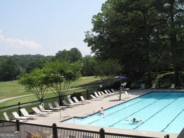 view of pool featuring a patio