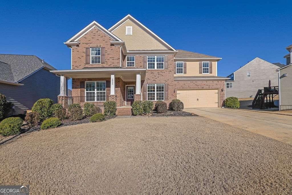 view of front of property featuring a porch and a garage