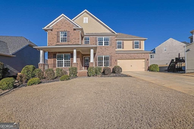 view of front of property featuring a porch and a garage