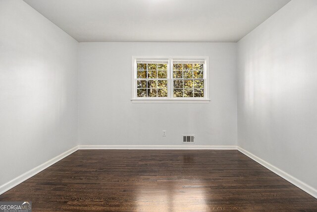 2540 Thornton Dr, Atlanta, GA 30349 - unfurnished bedroom with dark hardwood / wood-style floors and a closet