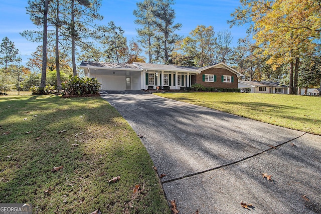 ranch-style house with a front yard and a carport