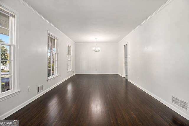 2540 Thornton Dr, Atlanta, GA 30349 - spare room featuring dark hardwood / wood-style floors, crown molding, and a chandelier