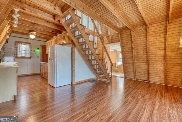 bonus room featuring ceiling fan, stairway, and wood finished floors