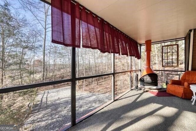 unfurnished sunroom featuring a healthy amount of sunlight