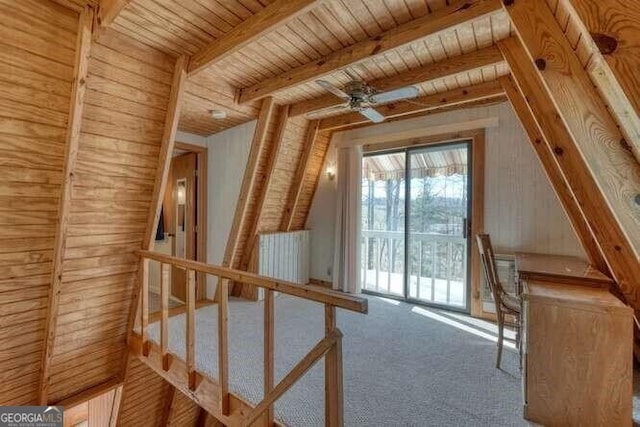 bonus room with wooden ceiling, carpet flooring, vaulted ceiling with beams, and radiator heating unit