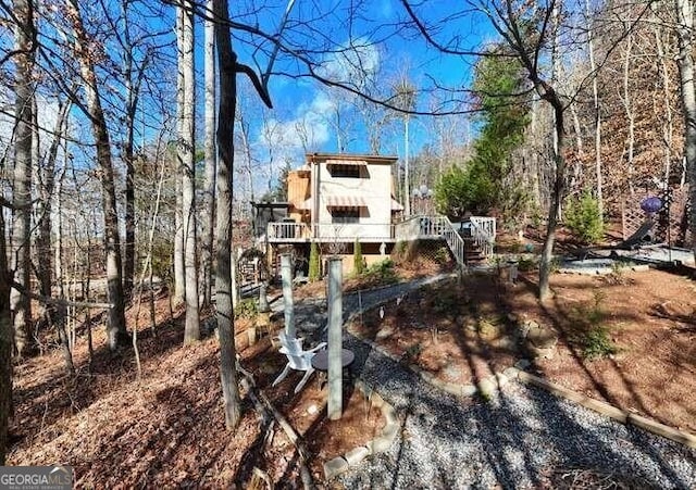 back of property with stairway