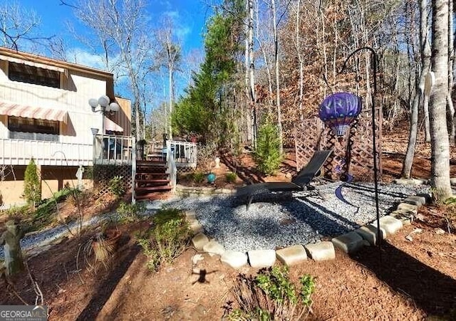 view of yard with a wooden deck