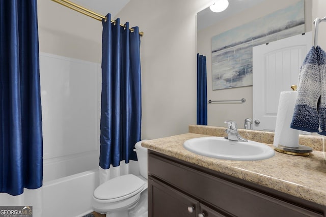 full bathroom featuring vanity, shower / bath combination with curtain, and toilet