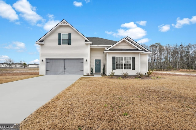 front of property with a front lawn and a garage