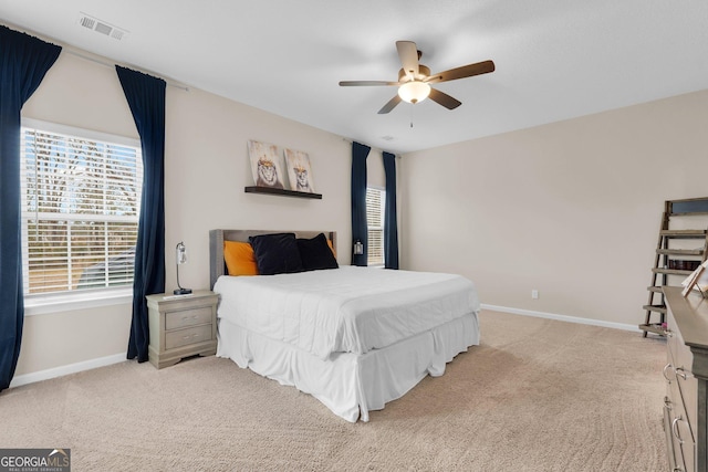 carpeted bedroom with ceiling fan