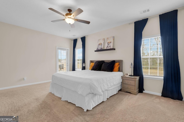 carpeted bedroom with ceiling fan