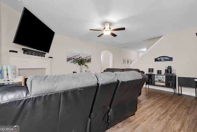 living room with ceiling fan and wood-type flooring