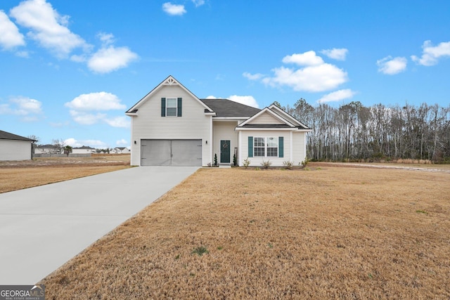 view of front of house featuring a front lawn and a garage