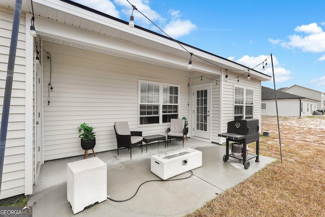 view of patio featuring an outdoor fire pit