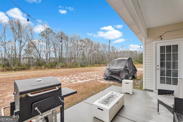 view of patio / terrace featuring a fire pit