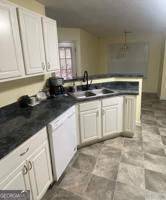 kitchen featuring white cabinetry, sink, hanging light fixtures, kitchen peninsula, and white dishwasher