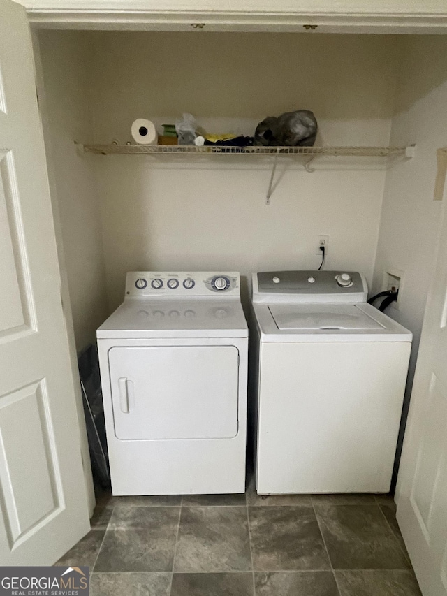 clothes washing area featuring washing machine and clothes dryer