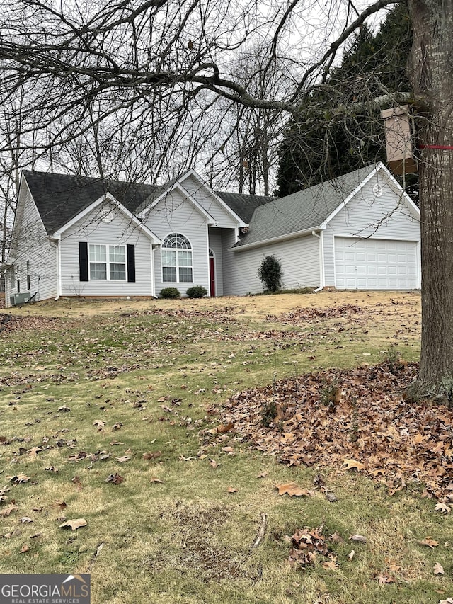 ranch-style house with a front lawn and a garage