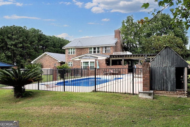 view of pool with a fenced in pool, a patio, a yard, and fence