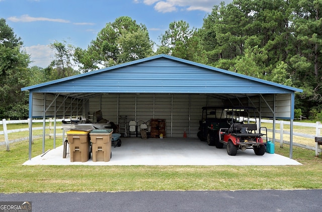 view of car parking featuring a carport and fence