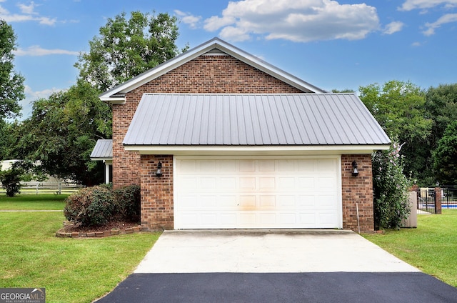 garage featuring concrete driveway