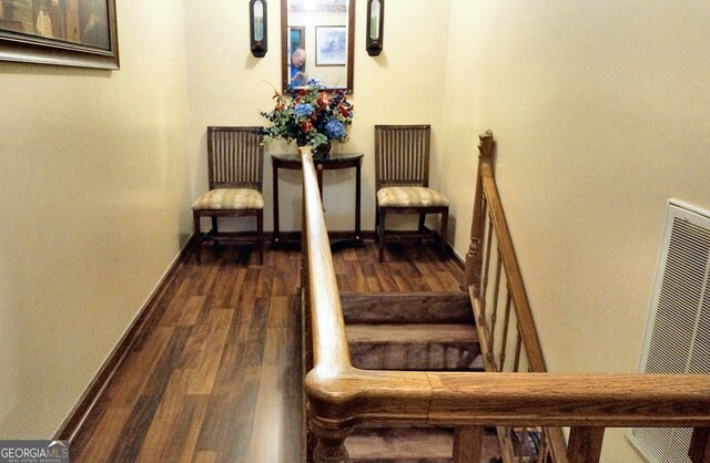 corridor featuring dark hardwood / wood-style flooring