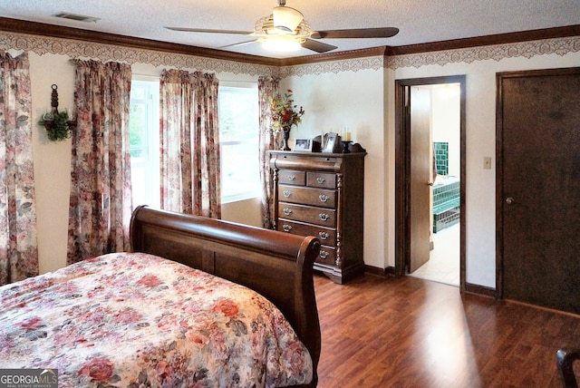 bedroom featuring a textured ceiling, ceiling fan, ornamental molding, and dark wood-type flooring