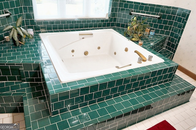 full bathroom with tile patterned flooring, baseboards, and a whirlpool tub