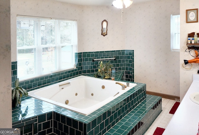 bathroom with tile patterned flooring, wallpapered walls, baseboards, and a whirlpool tub