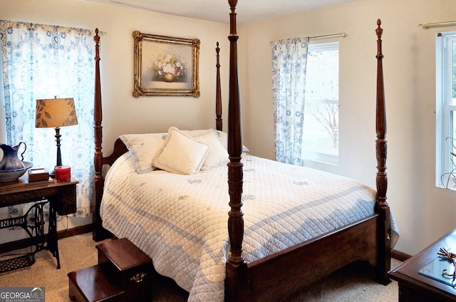 bedroom featuring light colored carpet