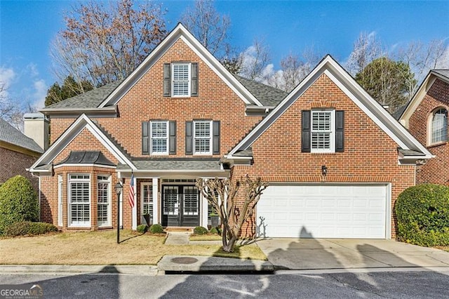 front of property with a garage