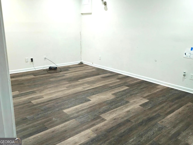 empty room featuring dark hardwood / wood-style flooring