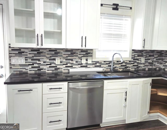 kitchen with backsplash, white cabinetry, dishwasher, and sink