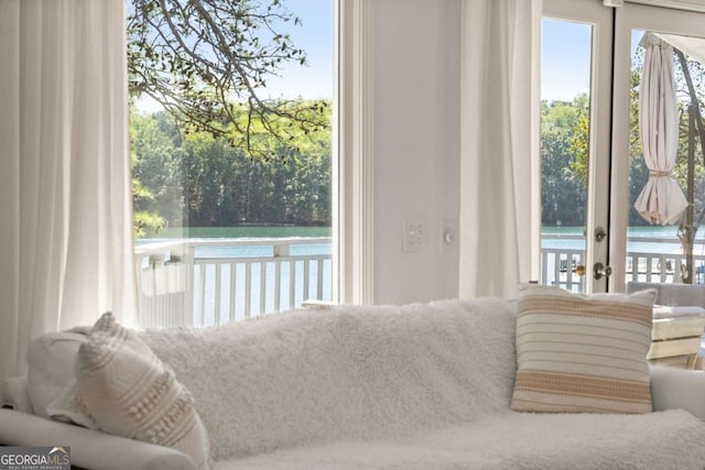 entryway with french doors and a water view