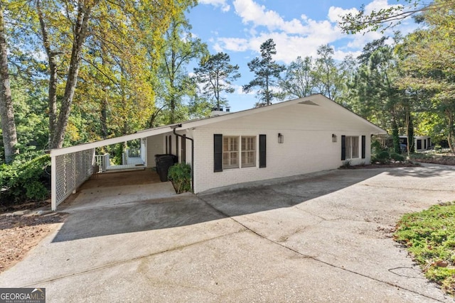 view of front of home with a carport