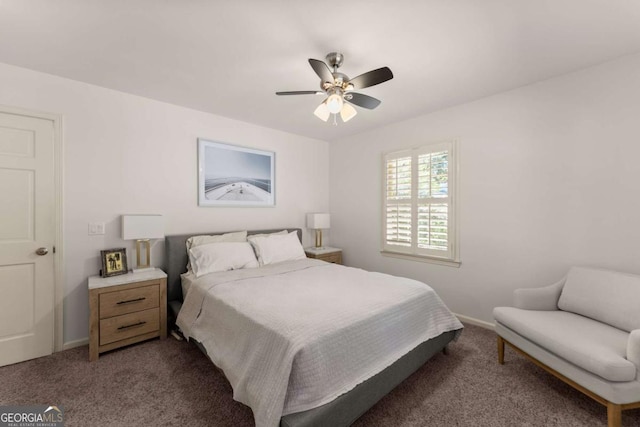 bedroom with ceiling fan and dark colored carpet