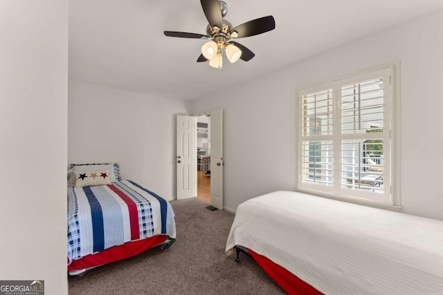 bedroom with ceiling fan and carpet floors