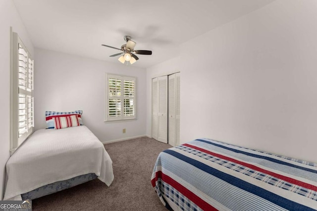 carpeted bedroom with a closet and ceiling fan