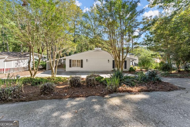 view of front of house with a patio area