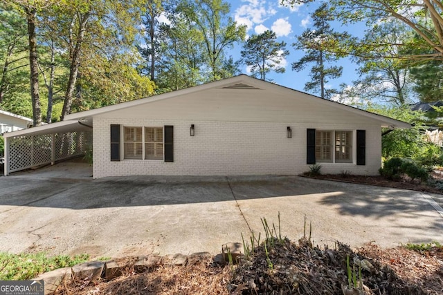 back of property with a carport