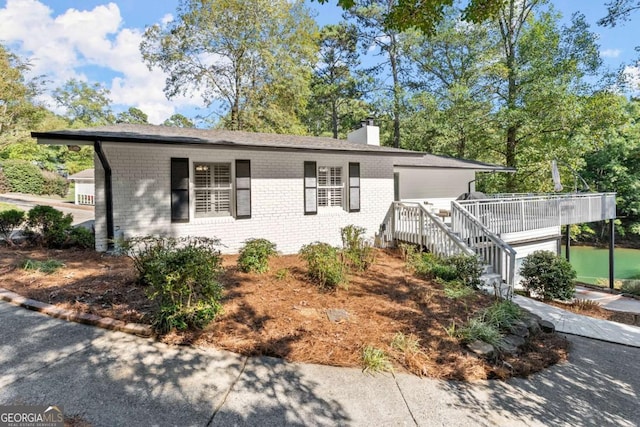 ranch-style home with a deck