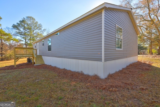 view of side of home featuring a deck