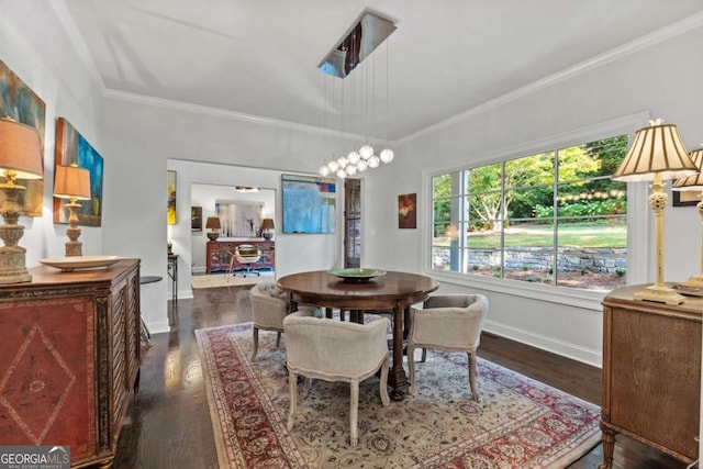 dining area with dark hardwood / wood-style floors and ornamental molding