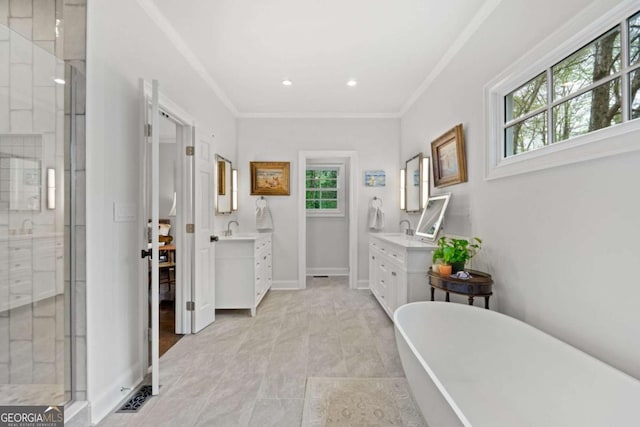 bathroom with vanity, a freestanding tub, a stall shower, and ornamental molding